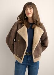 Dark brown short women's sheepskin coat KOZDP-0018-1I(Z26), front view of the product on a model. Half of the silhouette visible.-02