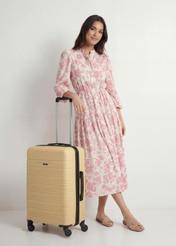 Medium suitcase on wheels WALAB-0083-2B-24(W26), diagonal view of the product next to the model's silhouette.