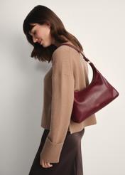 Burgundy women's handbag TOREC-1082-49(Z25), front view of the product on a model, half of the silhouette visible.
