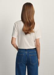 Cream basic women's T-shirt TSHDT-0120-0B(W26) - back view of the product on a model, against a white background. Knee-length silhouette visible.