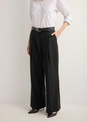 Women's black wide-leg trousers with a crease SPODT-0126-99(Z26), front view of the product on the model. Half of the silhouette visible.