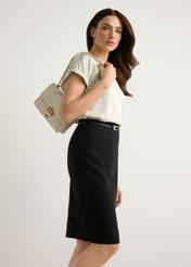 Small women's cream handbag TOREC-1186-0B(W26) - product view slightly diagonal, on a model, against a light background. Knee-length silhouette visible.