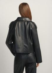 Black oversized women's leather jacket KURDS-0540-99(W26), back view of the product on the model. Half of the silhouette visible.