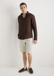 Brown men's linen shirt KOSMT-0321A-1I(W26) - front view of the product, on a model, against a light background. Full silhouette visible.