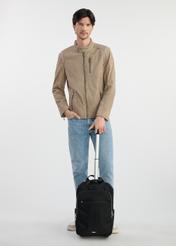 Black travel backpack - small suitcase TOREN-0307-99(W25), front view of the product on the model. The whole silhouette is visible.