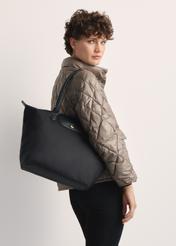 Black fabric bag TOREN-0317-99(Z25) - front view of the product on a model against a white background. Half of the silhouette visible from the side.