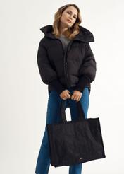 Women's tote bag TOREN-0268A-99(Z25), product view in model's hands. Half of the silhouette visible.