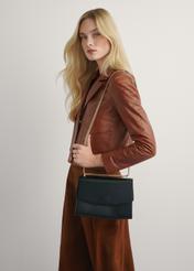 Elegant black women's messenger bag TOREC-1165-99(W26), product view on model's shoulder. Half of silhouette visible.