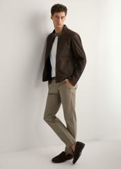 Brown men's suede jacket KURMS-0396-1I(W26) - side view of the product, on a model, against a light background. Full silhouette visible.