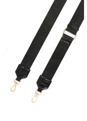 Black small women's croco handbag TORES-1049-99(Z 25), close-up of the detachable strap of the product, view on a white background.