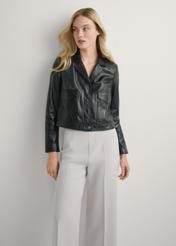 Women's black leather short jacket KURDS-0471-99(W26), front view of the product on the model. Half of the silhouette visible.