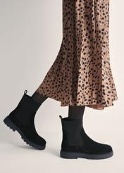 Women's black suede Chelsea boots BUTYD-1194-9E(Z26) - side view of the product on a model against a white background. Half of the silhouette visible.