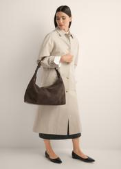 Brown suede handbag TORES-1404-1I(Z26) - front view of the product, held by the model, against a light background. The entire silhouette is visible.