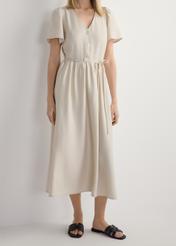 Women's black leather braided slides BUTYD-1225-99(W26), front view of the product on the model's feet, against a white background. Half of the silhouette visible.