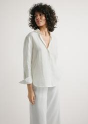 Women's white linen shirt KOSDT-0163A-0B(W26) - front view of the product, on a model, against a light background. Half of the silhouette visible.