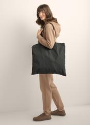 Soft black bag TOREN-0361-9P(Z26) – front view of the product, shown on a model against a light background. Full-body view.