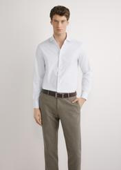 Men's white cotton shirt KOSMT-0358-0A(W26) - front view of the product, on a model, against a light background. Half-length silhouette visible.