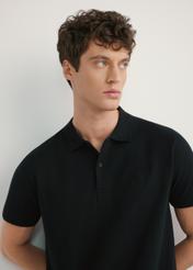 Men's black polo shirt POLMT-0084-99(W26) - front view of the product, on a model, against a light background. Half of the silhouette visible.