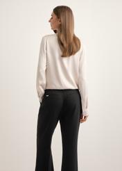 Cream women's viscose blouse BLUDT-0216-1A(Z26), back view of the product on the model, half of the silhouette visible.