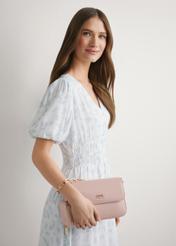 Light pink women's messenger bag with chain TOREC-0767-5A(W26), view of the product in the model's hand. Half of the silhouette visible.