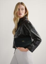 Black women's imitation leather handbag TOREC-1081-99(W26), product view in model's hands. Half of silhouette visible.