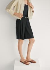 Women's leather camel flip-flops BUTYD-1224-1D(W26), side view of the product on the model's feet, on a light background.