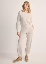 Light beige women's trousers SPODT-0117-80(Z25), front view of the product on the model. Full body visible.