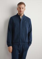 Men's navy blue zip-up sweatshirt BLZMT-0072-7E(W26), front view of the product on the model. Half of the silhouette visible.