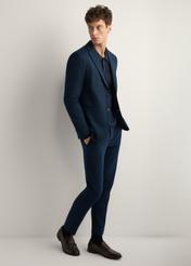 Men's navy blue trousers SPOMT-0115-7E(W26), side view of the product on the model. Full silhouette visible.