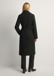 Black long women's coat PLADT-0048B-99(Z25), product view from the back on the model, the whole silhouette is visible.