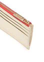 Small women's leather wallet in cream color PORES-0946F-16(W25) - close-up of the gold zipper, on a white background.