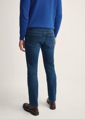 Navy blue men's jeans JEAMT-0022-17(Z25) - product view from the back on the model on a white background. Half of the silhouette visible.