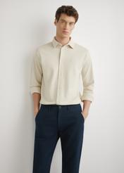 Beige men's cotton shirt KOSMT-0356-1A(W26), front view of the product on the model. Half of the silhouette visible.