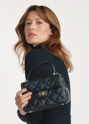 Black small quilted women's handbag TOREC-1092-99(Z25), product view on the model, half of the silhouette visible.-02