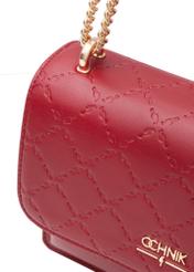 Red women's handbag with monogram TOREC-1155-4B(W26) - close-up of the detail on a white background.