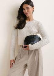 Women's leather toiletry bag with a crocodile-effect finish (TORES-1439-9G(Z26), front view of the product shown on a model. Half-body shot.