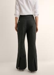 Black floral wide leg trousers SPODT-0127-99(Z26), back view of the product on the model. Half of the silhouette visible.
