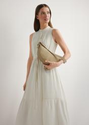 Beige leather semi-circular handbag TORES-1309-0B(W26), product view in model's hand. Half of silhouette visible.