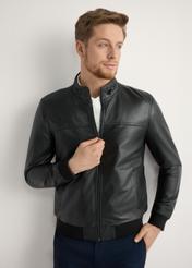 Men's black leather jacket KURMS-0392-99(W26) - front view of the product, on a model, against a light background. Half of the silhouette visible.