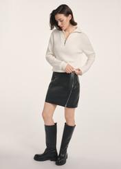 Black leather mini skirt SPCDS-0079-3206(Z25) - side view of the product on a model on a white background. The entire silhouette is visible.