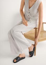 Women's black leather slides BUTYD-1163-99(W26) - front view of the product, on a model, against a white background. Silhouette visible.