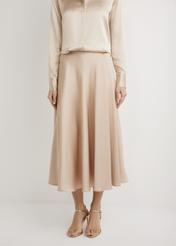 Long beige midi skirt SPCDT-0131-1B(W26), front view of the product on the model. Half of the silhouette visible.