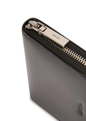 Black leather women's wallet PORES-0976-99(Z25), close-up of product detail, view on white background.