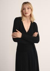 Black women's sweater with tie SWEDT-0234-99(Z25), front view of the product on the model. Half of the silhouette visible.