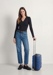 Cabin suitcase on wheels WALPC-0012-7C-16(W26), side view of the product next to the model's silhouette.