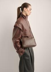 Small brown leather women's handbag TORES-1353-1H(Z26), diagonal view of the product on the model. Half of the silhouette visible.