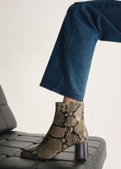 Leather high-heeled ankle boots with snakeskin motif BUTYD-1218-86(Z25), view of the product on the model's foot.