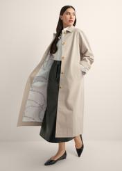 Long beige women's coat KURDT-0692-1J(Z26), product view from the side on the model, the whole silhouette is visible.