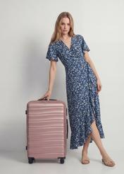 Medium suitcase on wheels WALAB-0081-5X-24(W26), front view of the product next to the model's silhouette.