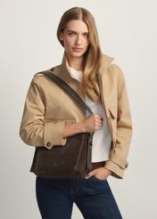 Women's brown leather handbag TORES-1251-1I(W26) - diagonal view of the product, on a model, against a light background. Knee-length silhouette visible.